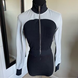 Cropped black and gray workout jacket.